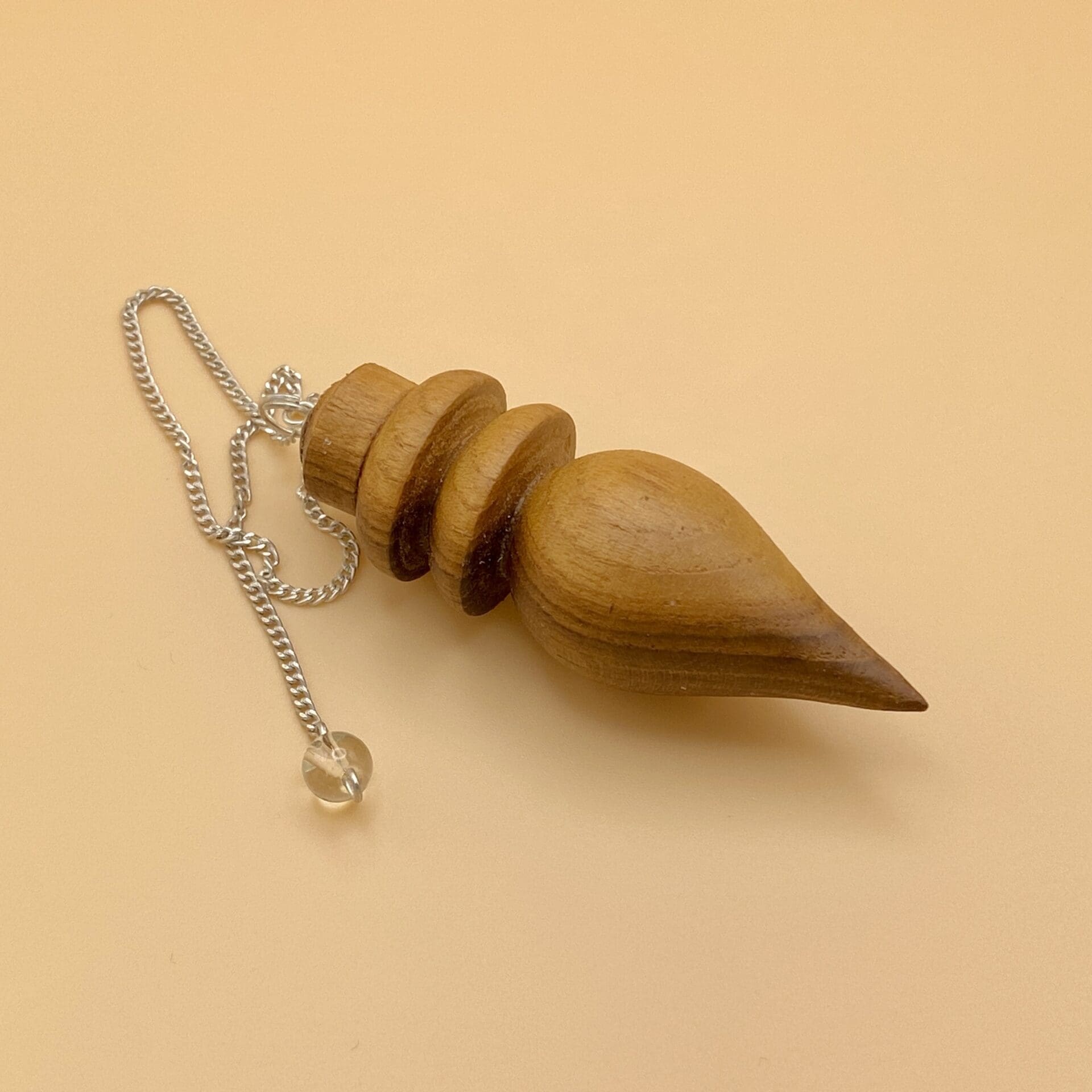 Péndulo Karnak de madera natural con dos anillos