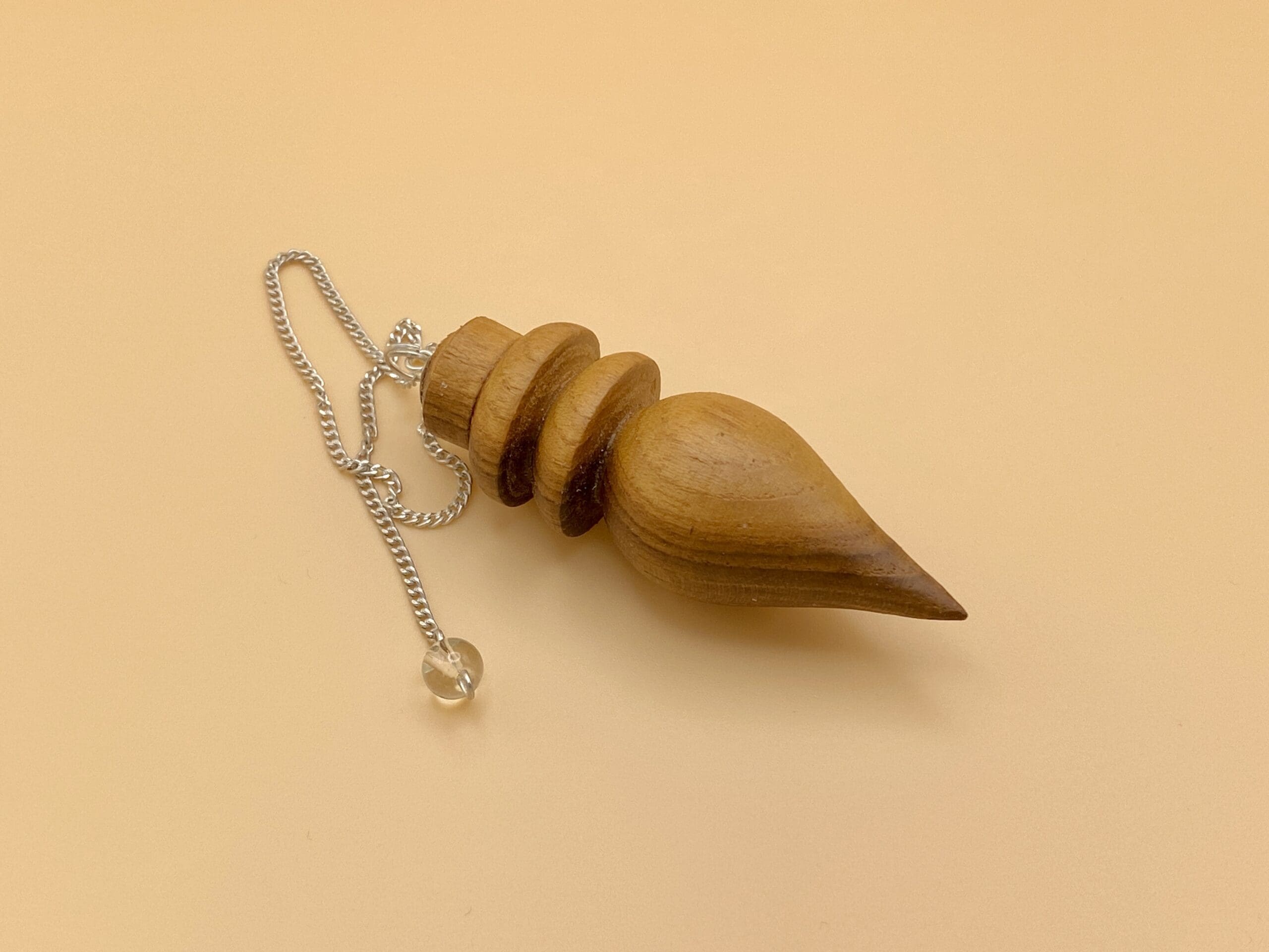 Péndulo Karnak de madera natural con dos anillos