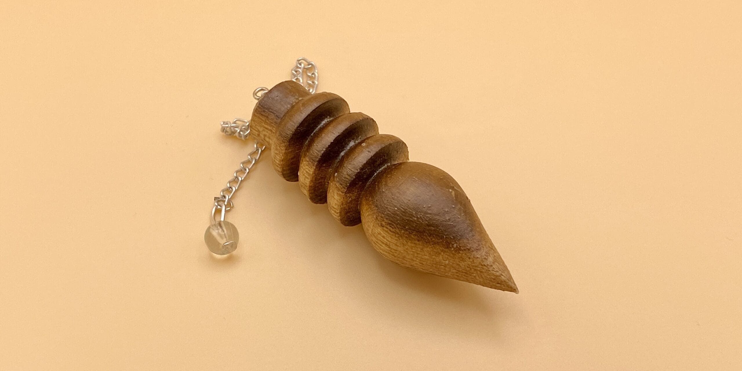 Péndulo Karnak de madera natural de tres anillos